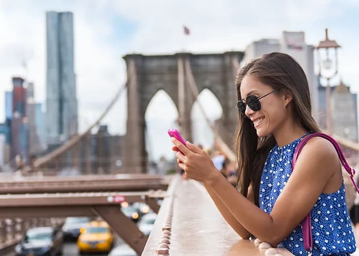 Woman using smartphone in American city